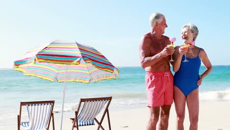 retired old couple drinking cocktails