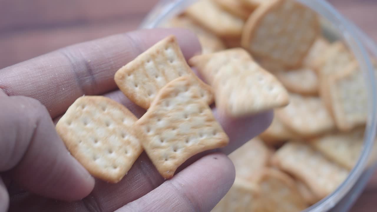 Hand holding assorted crackers