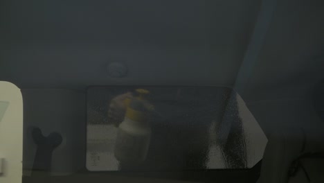 car side window tinting foil process. spraying tinting foil