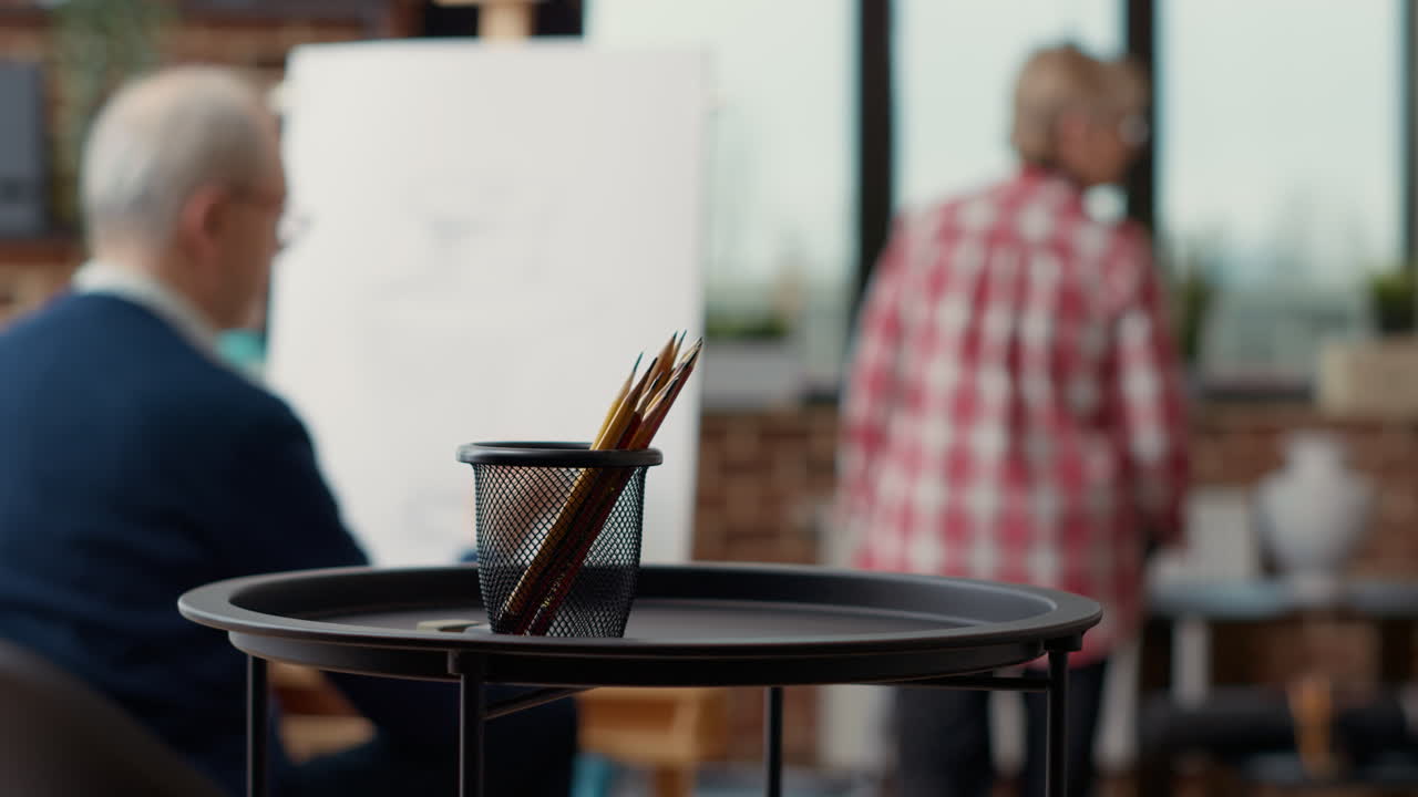 Colorful pencils on table in creative educational workshop