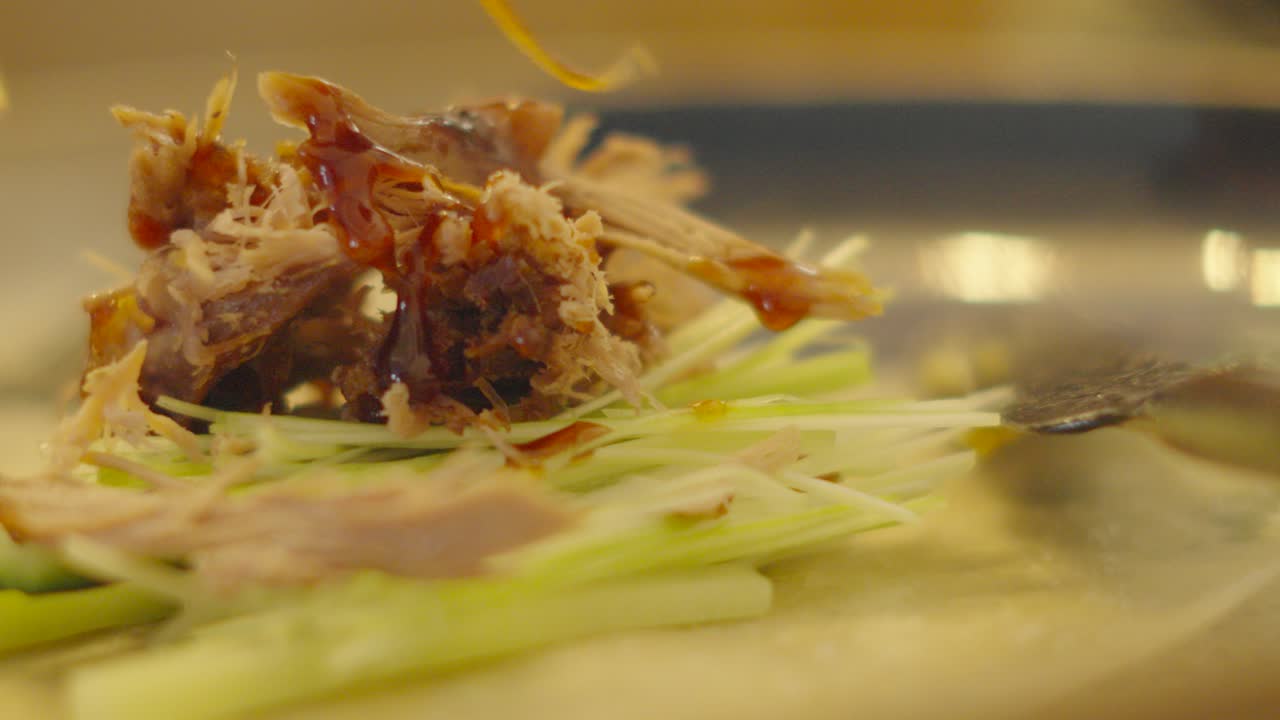 Delicious Chinese Crispy Duck Pancake Being Dressed with Sticky Hoisin Sauce with Spring Onions and Cucumber. Elegant High Quality Food Footage