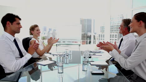 team of business people looking at whiteboard