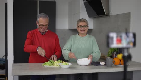 Elderly-couple-cook-together,-explain-recipe-and-record-video-for-vlog-and-social-media