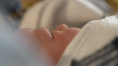 face of newborn baby with soft skin