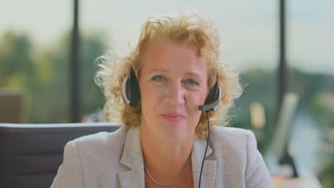 businesswoman wearing headset in office