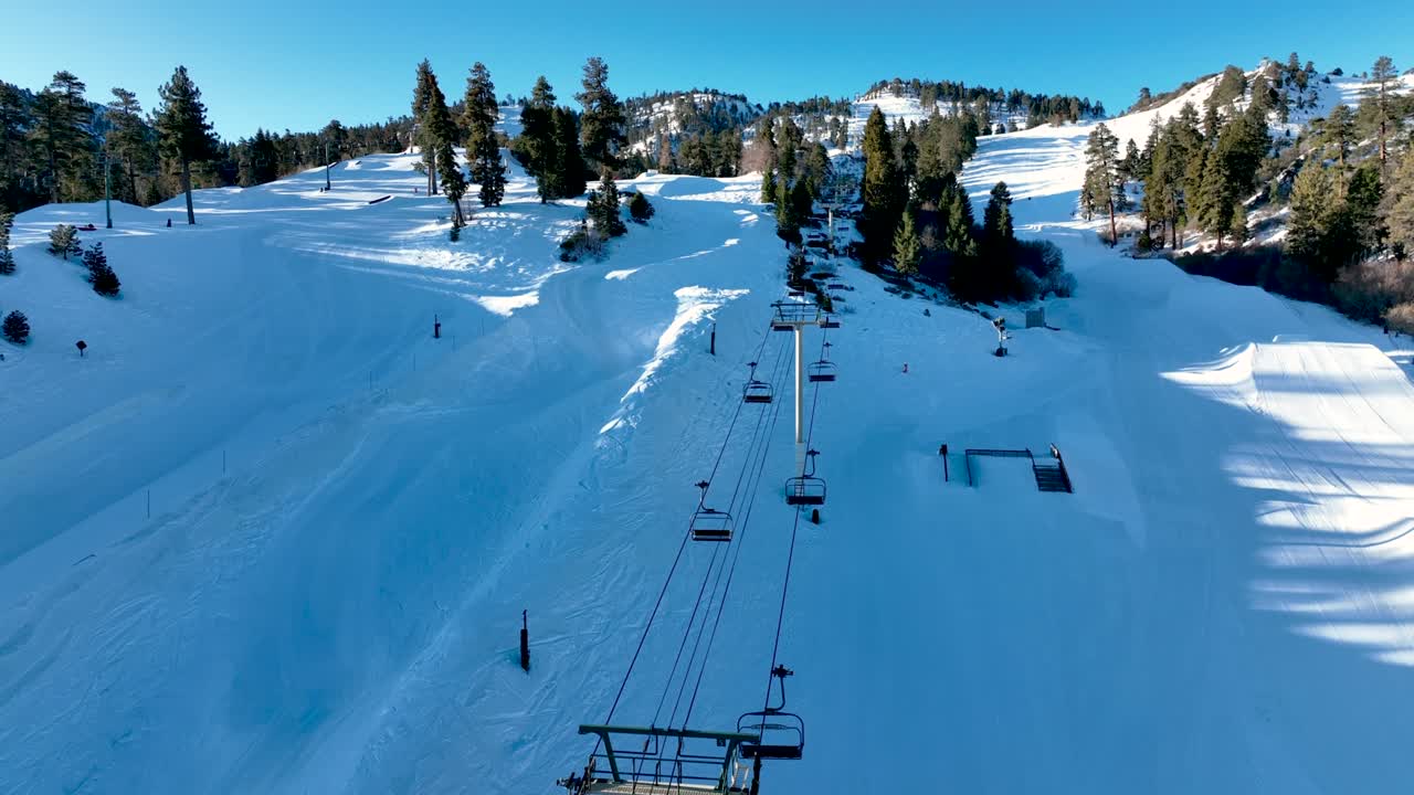 Ski lift seat and snowing mountain