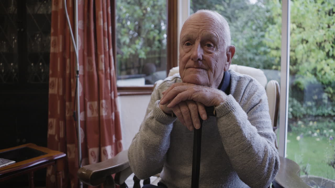 Portrait of a senior man in a chair