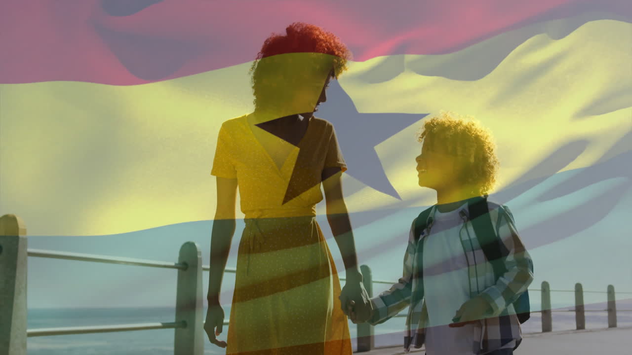 Walking by ocean, mother and child with Ghana flag animation overlay