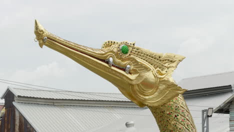 close-up shot of suphannahong, decorated at the stern of one of the thai royal barges docked at the national museum in bangkok, thailand