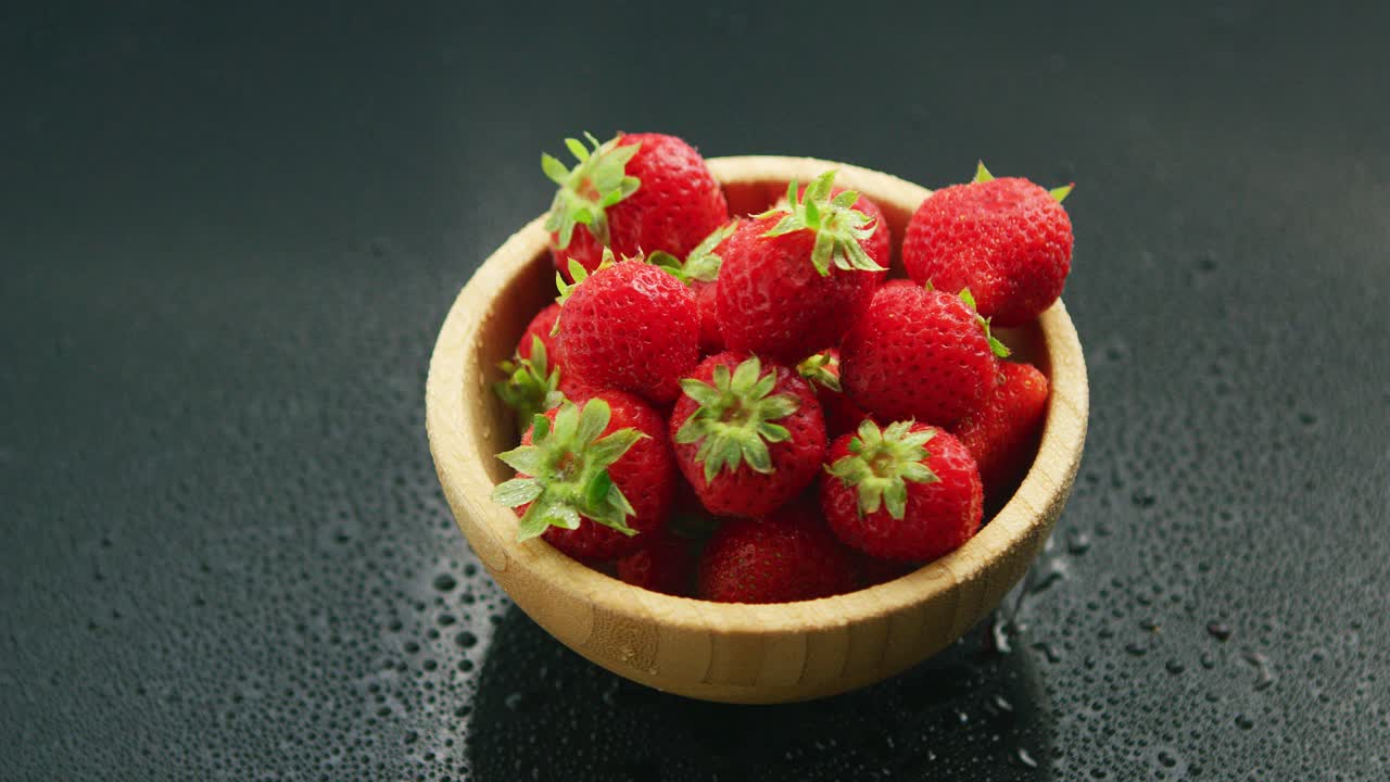 Small bowl of fresh red strawberry
