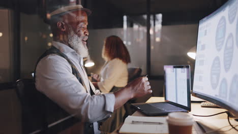 senior businessman working late in office