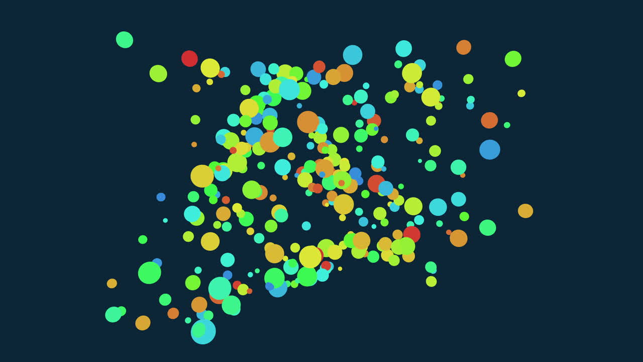 Levende farvede prikker på en blå baggrund skaber et stjernelignende mønster i billedet. Prikkerne har grønne, gule, røde og lilla farver, hvilket danner en visuelt slående og farverig fremvisning
