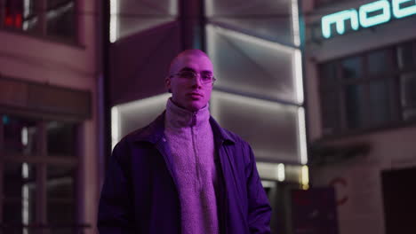 man in a city at night