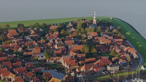 aerial drone view of small village with orange roofs, hindeloopen, friesland