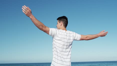 man standing on the beach