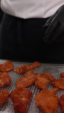 chef preparing spiced chicken in an air fryer