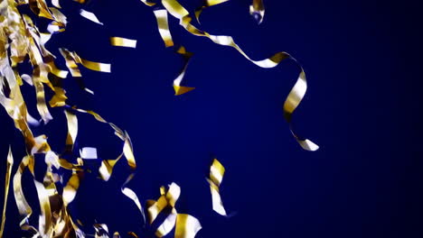 gold confetti on a dark blue background