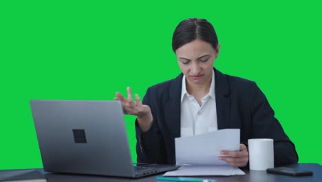 Confused-Indian-female-manager-working-on-laptop-Green-screen