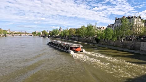 tourist boat navigating the seine in paris