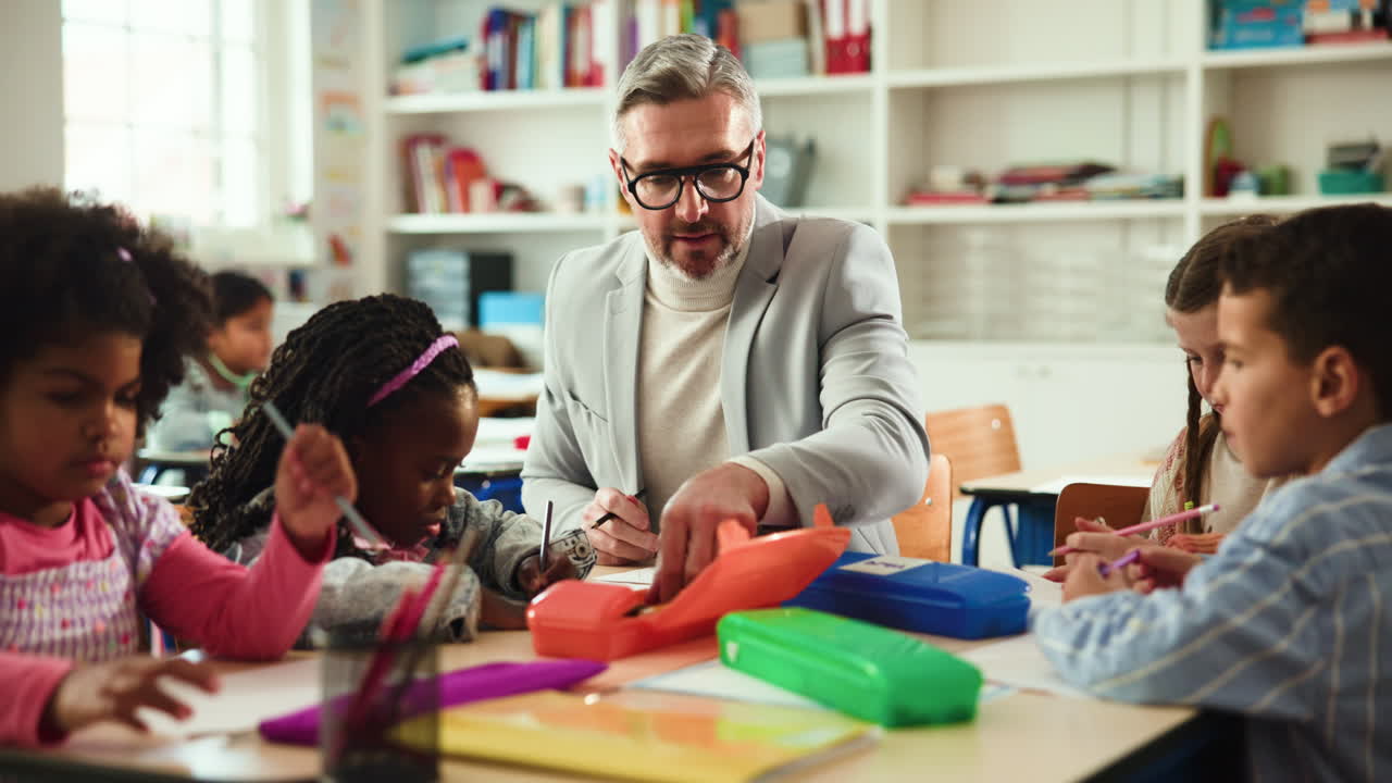 Teacher assisting students in a classroom