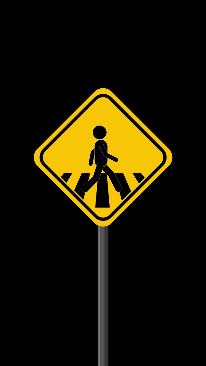 Yellow pedestrian crossing road sign animates as walking figure moves across striped crosswalk
