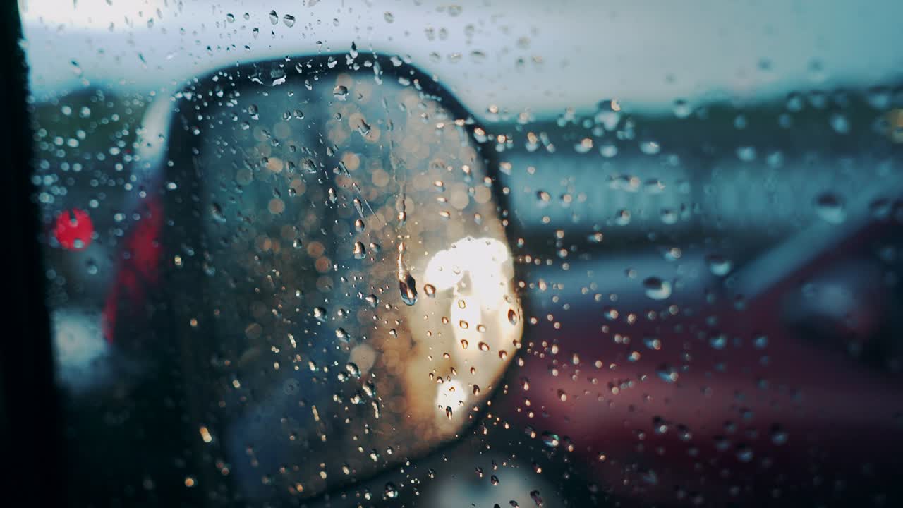 Windscreen at the time of the rain. Mirror of car