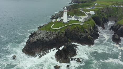 Aerial-view,-fly-away-shot,-4K,-Fanad-Head-Lighthouse,-located-in-the-north-coast-of-Ireland