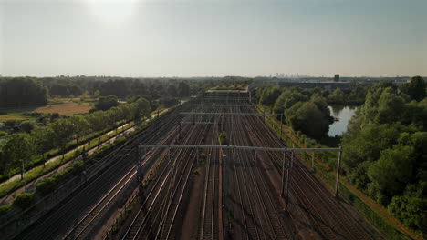 fly over multi-railroad of barendrecht train station in south holland, netherlands. aerial drone shot