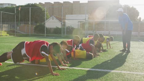 soccer kids exercising in a sunny day