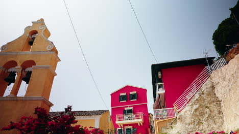 walking through the narrow streets of lakones mountain village in corfu, greece