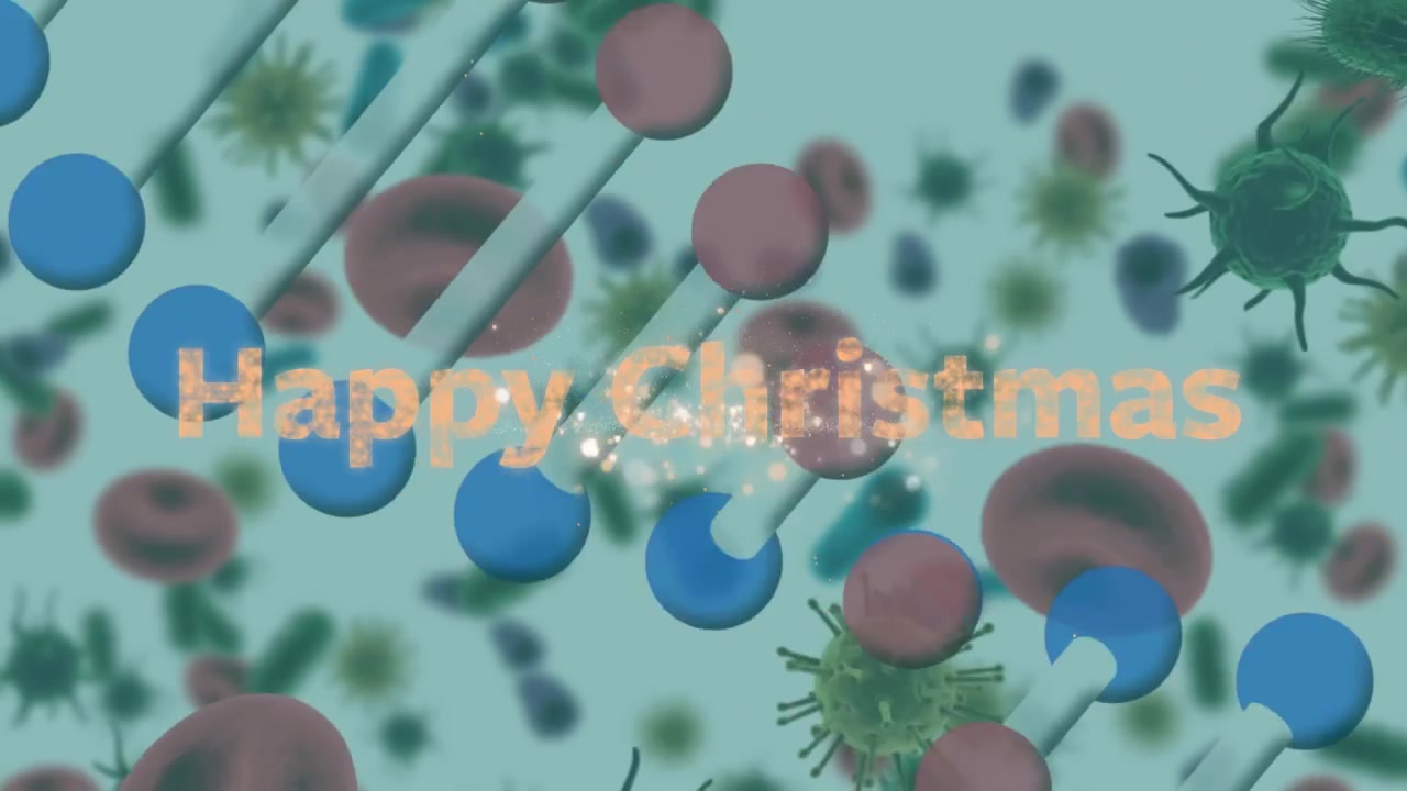 「ハッピークリスマス」のテキスト、花火、そして赤血球と癌細胞の上に重なるDNAらせんのアニメーション。