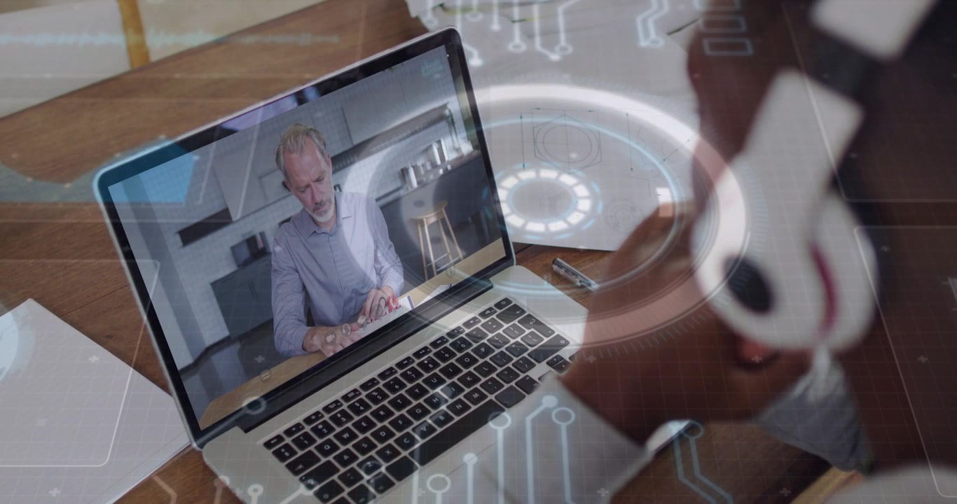 Man with headset watching laptop host speaking, starting circuit overlay growing over user for tech