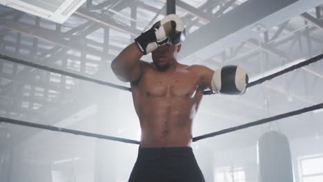 video of fit african american man boxing at gym