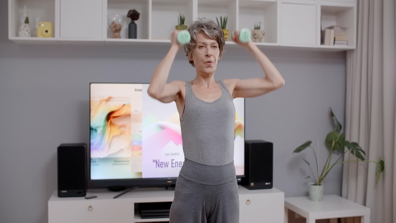 Senior Woman Doing Dumbbell Exercise at Home
