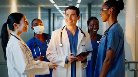 diverse medical team in hospital corridor