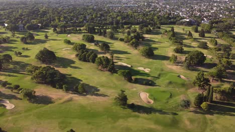 Aerial-flyover-green-jockey-golf-club-of-San-Isidro-in-Buenos-Aires-during-sunny-day