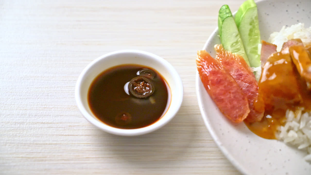crispy belly pork on rice with barbecue red sauce