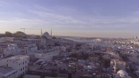 Aerial-of-Instanbul-Turkey-old-city-skyline-with-mosques-and-Bosphorus-River-bridges-distant