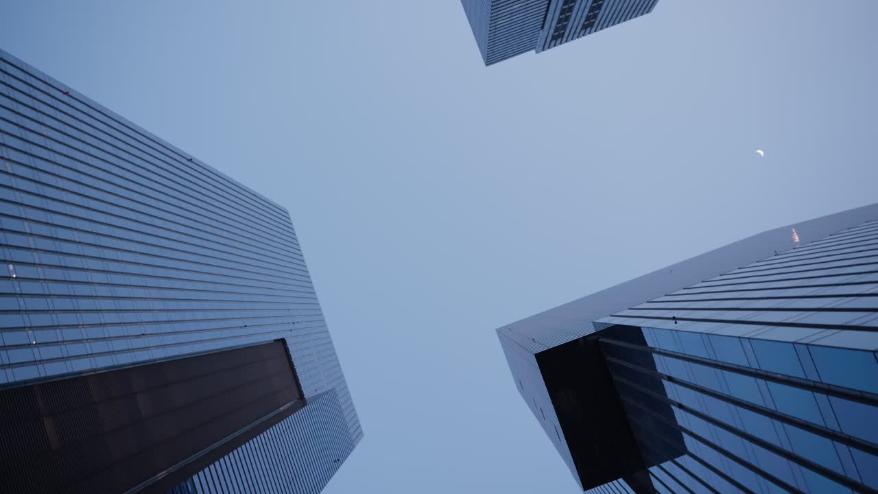 Looking Up At Sleek Glass Towers Of Samsung Town Against Pale Sky In Seocho, Seoul, South Korea. low angle, rotating shot