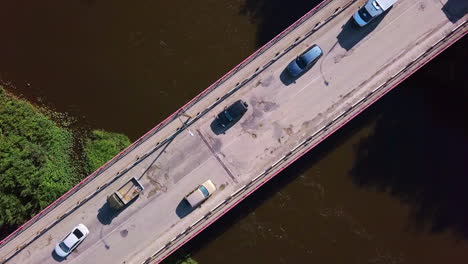 cars on a bridge over a river