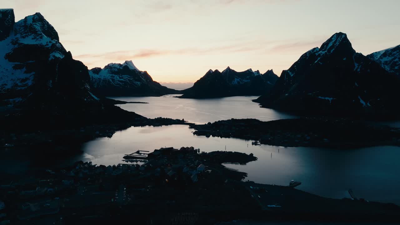 Settlements Surrounded By Towering Mountains At Reine Fishing Village In Moskenes Municipality, Nordland County, Norway.