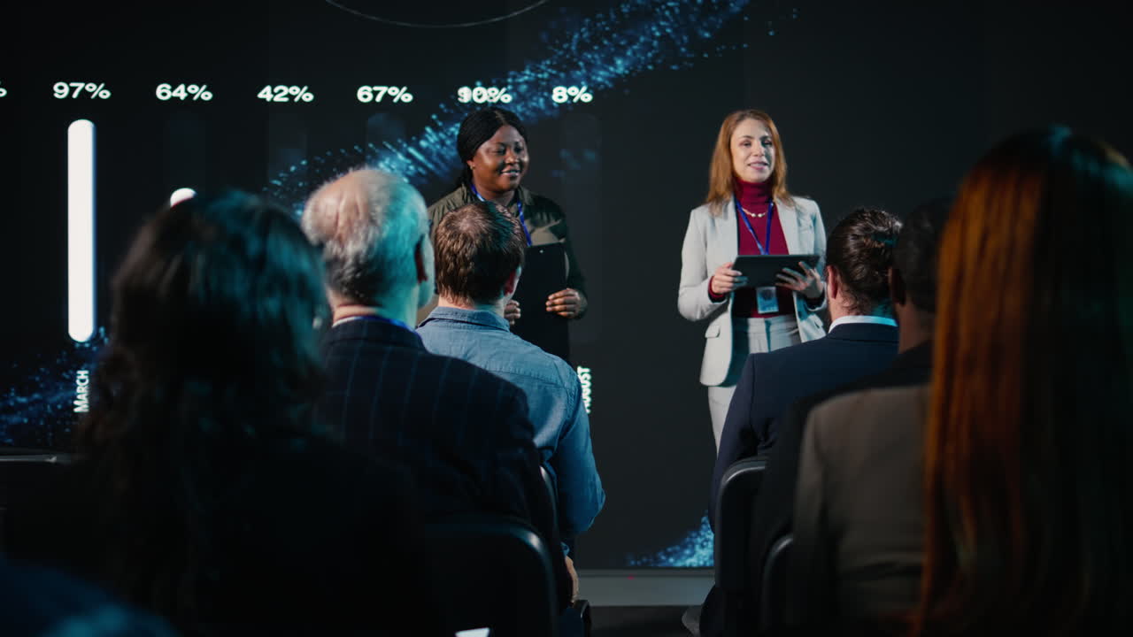Diverse team of female presenters hosting a business conference