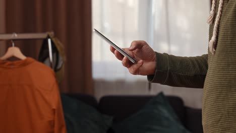 person using a smartphone in a room