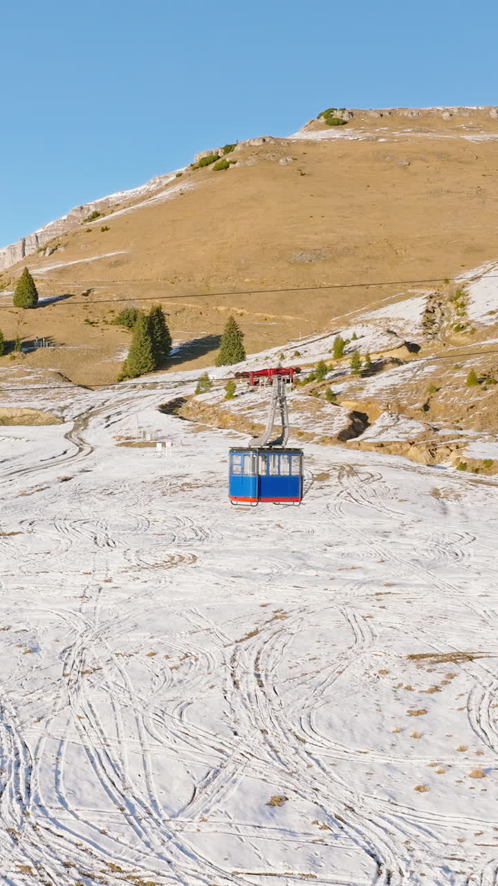 Aerial drone view of a little snow on the Bucegi Mountains, near Brasov, Romania. Vertical