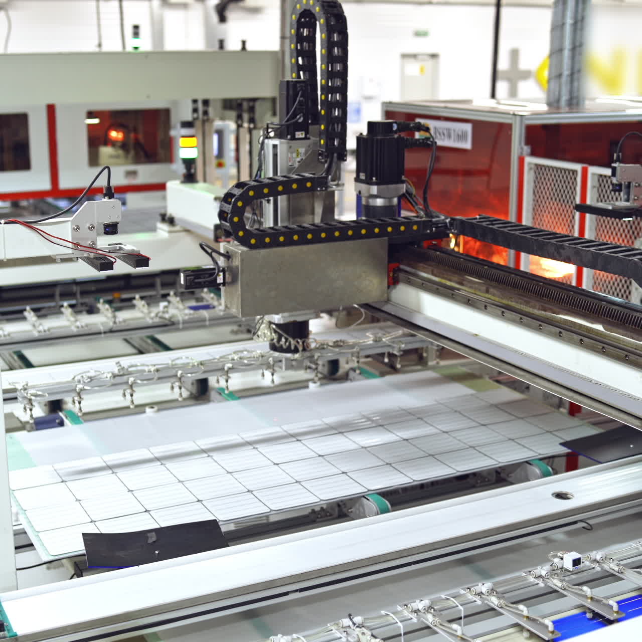Robotic equipment for producing solar panels. Automated manufacturing of solar cells in a modern factory.