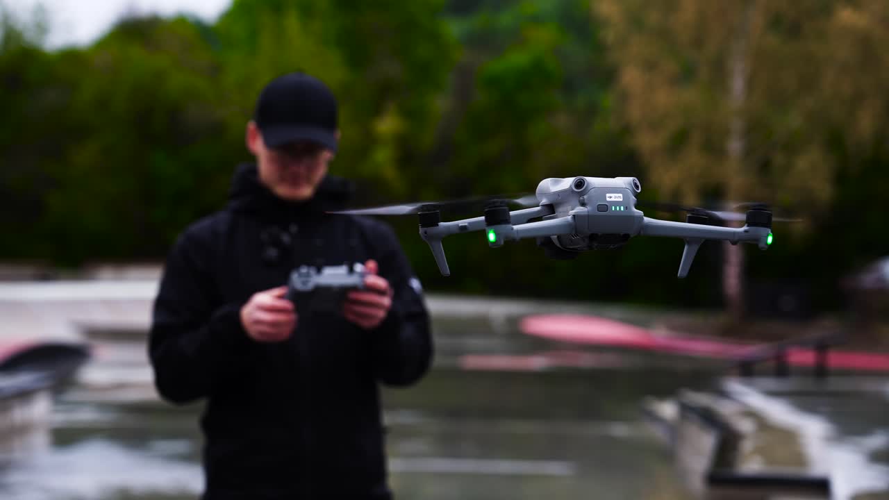 Drone pilot adjust aircraft settings with remote control while hover, Czechia