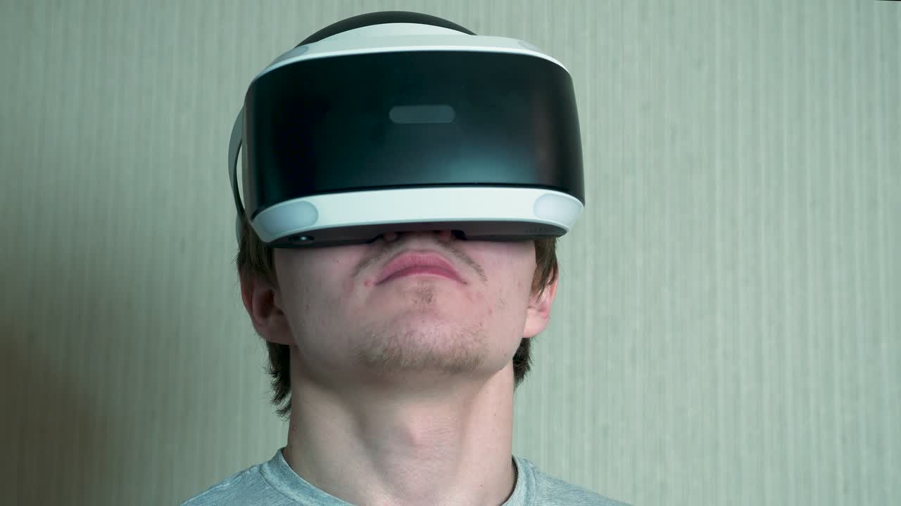 Young Man Wearing VR Headset