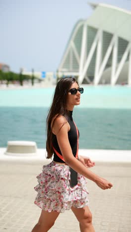 young woman walking in a city park