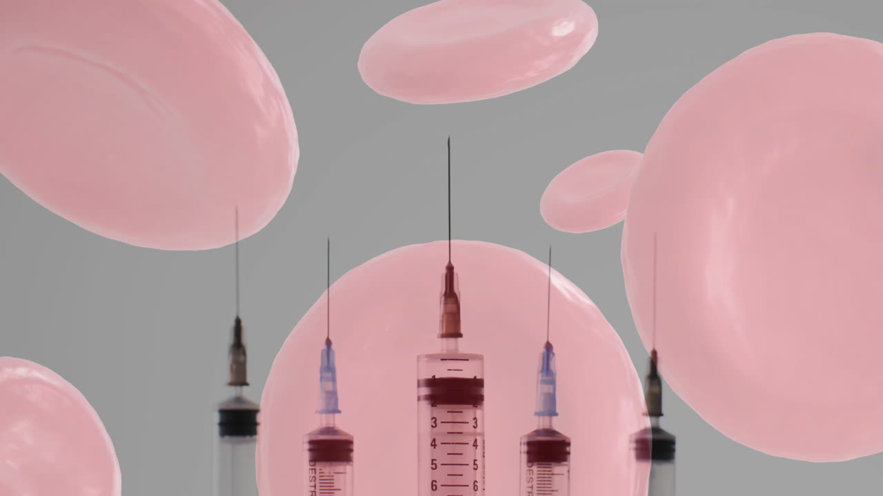 회색 배경에 적혈구와 주사기의 애니메이션