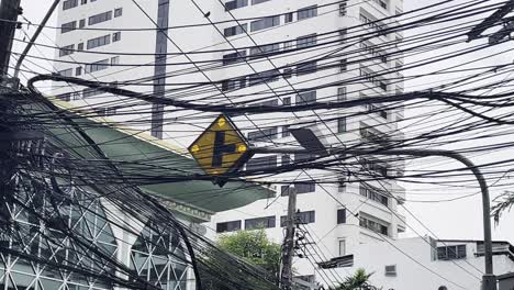 traffic lights and electricity cables, wired cityscape of southeast asian town